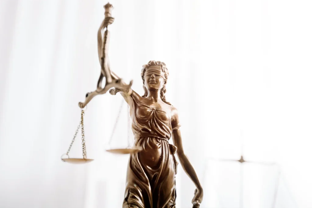 Statue of Lady Justice; Milani Law Firm in Tehran providing specialized legal services to companies and traders